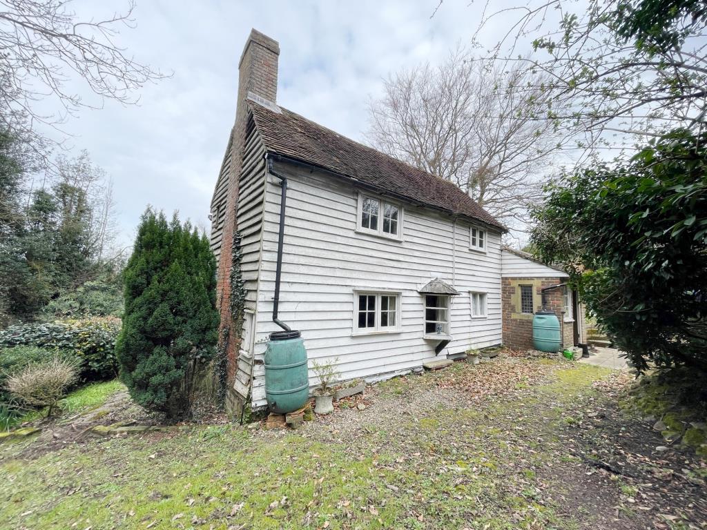Lot: 59 - DETACHED COTTAGE AND CABIN WITH POTENTIAL AND APPROX 20 ACRES OF WOODLAND - front view of cottage in Chelsfield